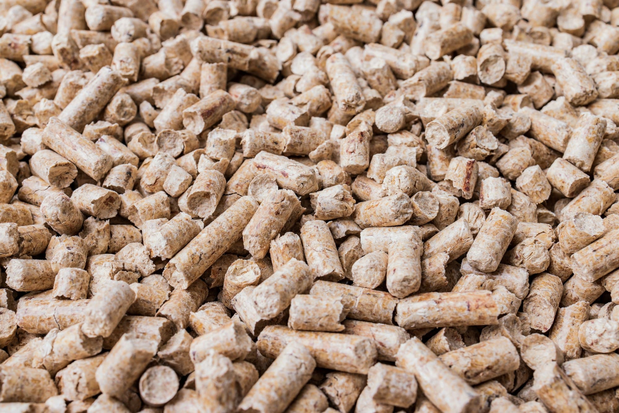 Wood pellets background texture. Alternative biofuel from sawdust.