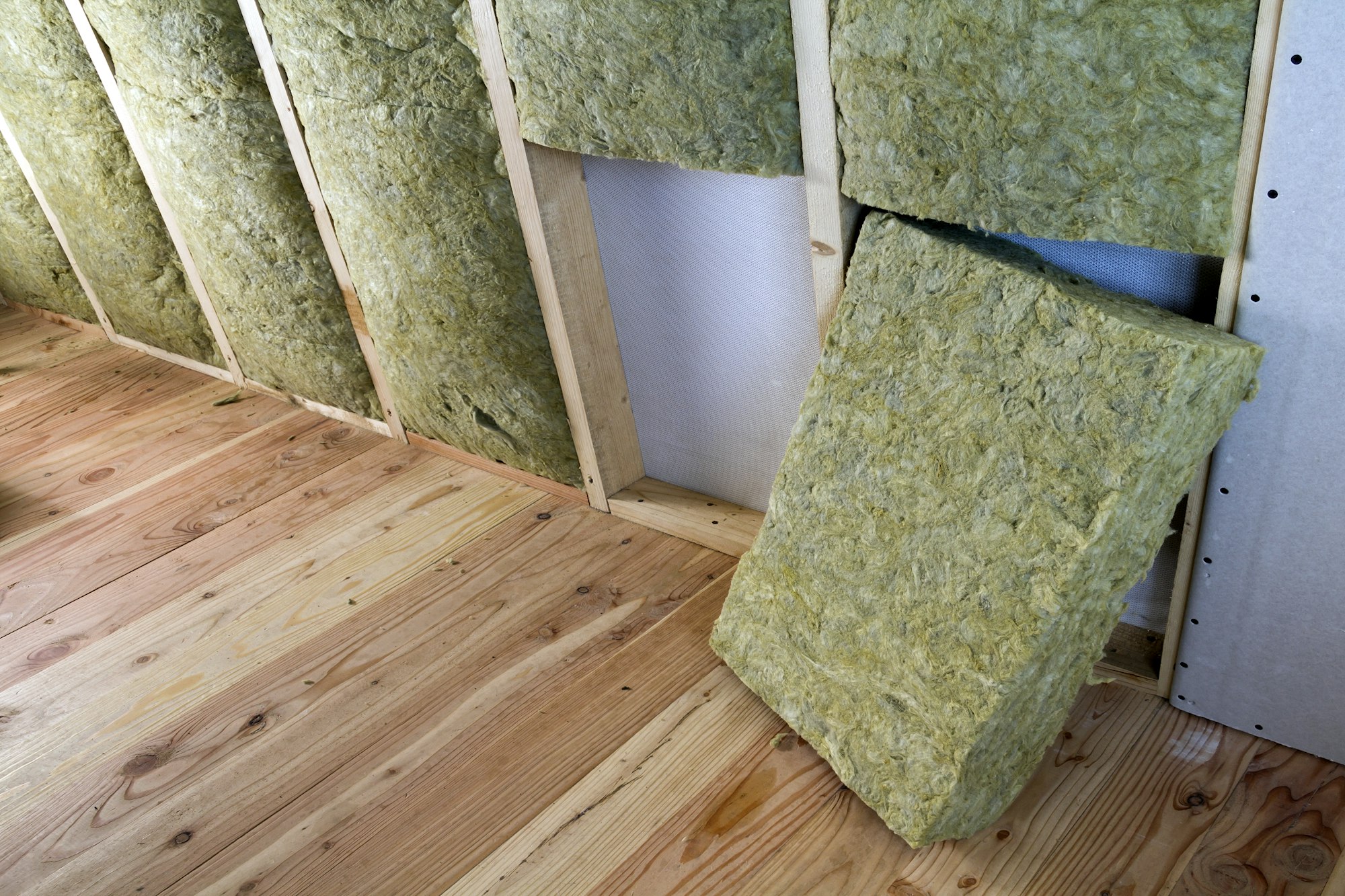 Wooden frame for future walls with drywall plates insulated with rock wool