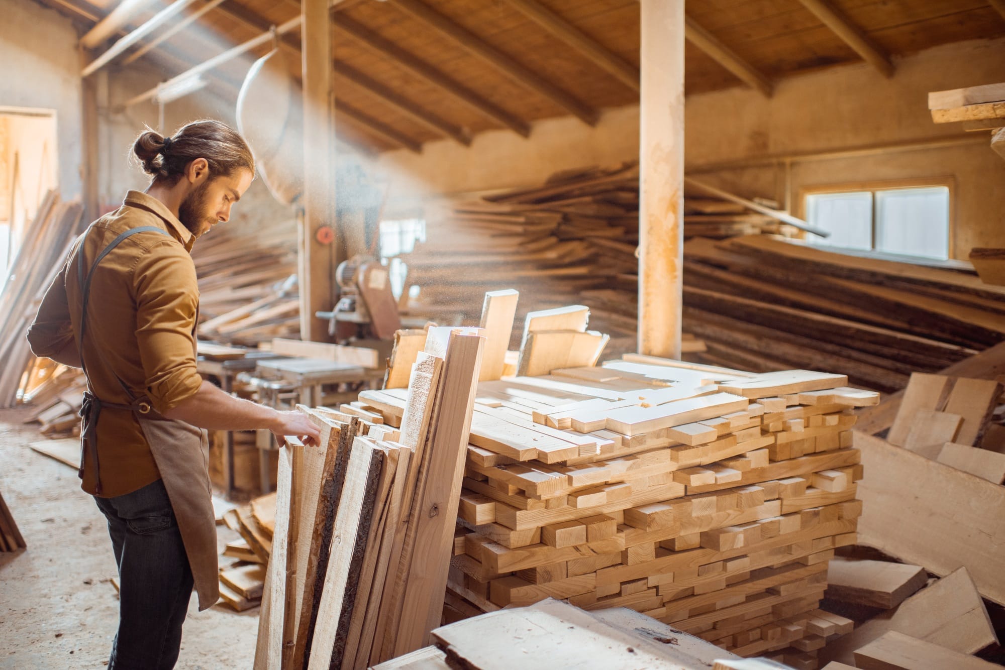 Carpenter at the wood storage