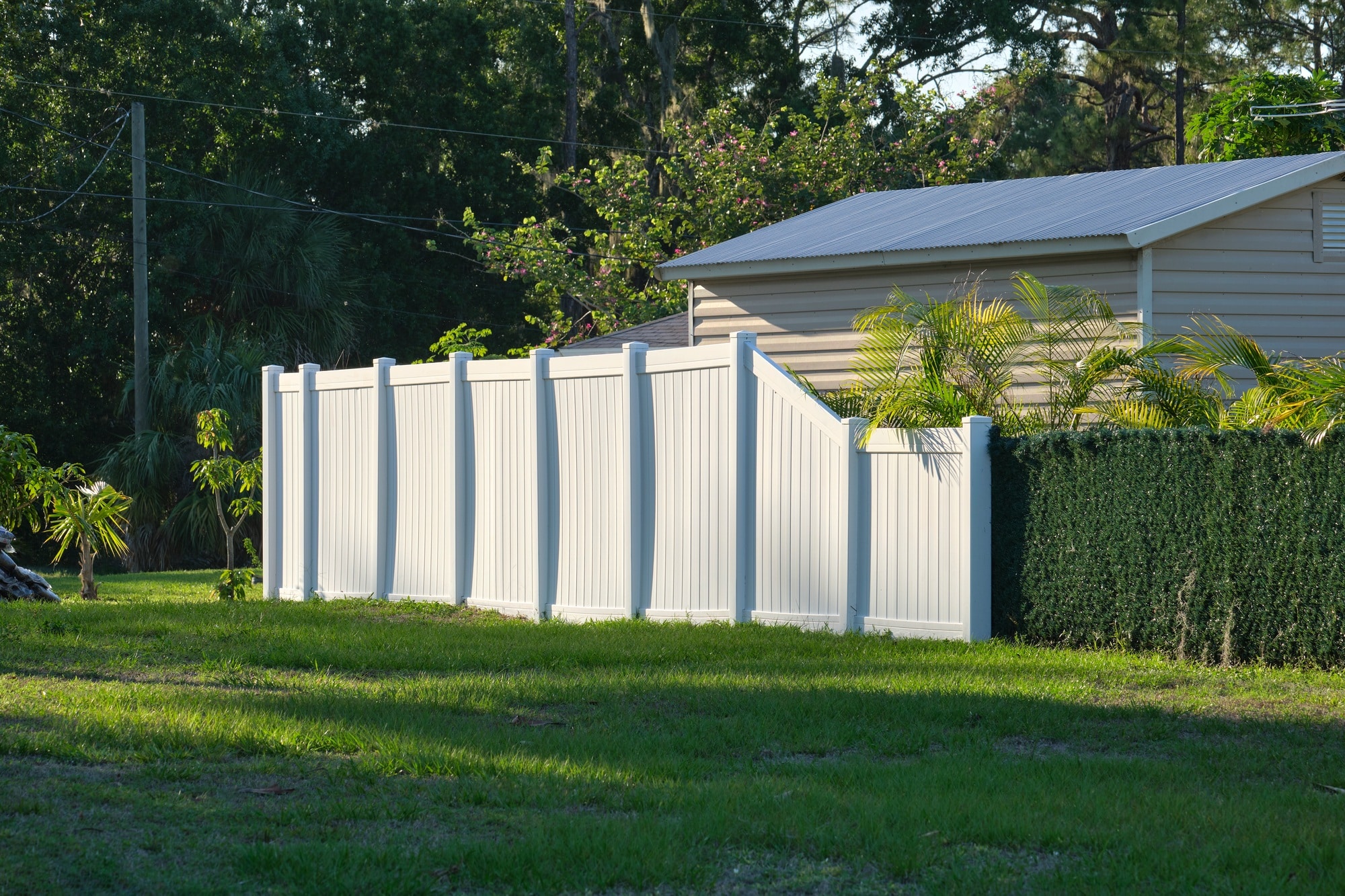 White plastic fence for back yard protection and privacy